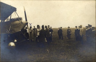 Archduke Joseph talks with an aviator beside a biplane, Novi Sad Airfield, 12 May 1913