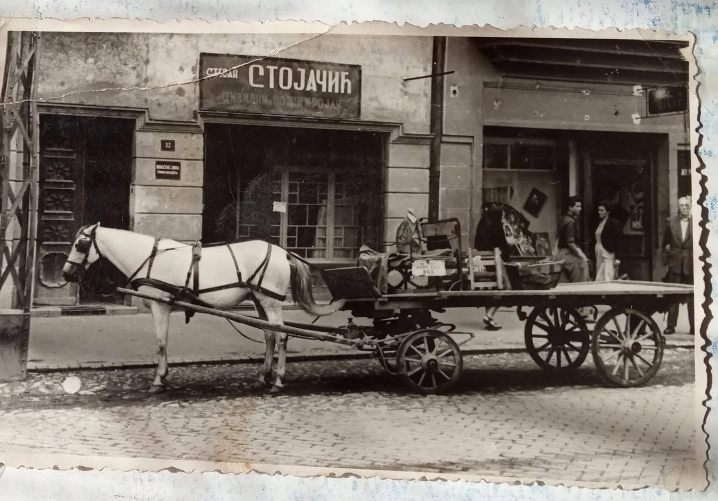 A carter waiting outside Stojacic the tailor, Jewish Street, Novi Sad, 1937–1938