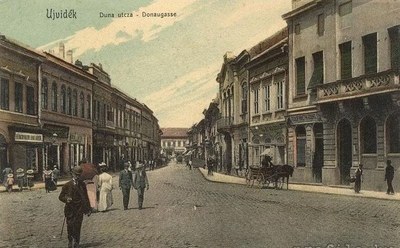 Walkers coming up the street, Dunavska Street, Novi Sad, 1900s