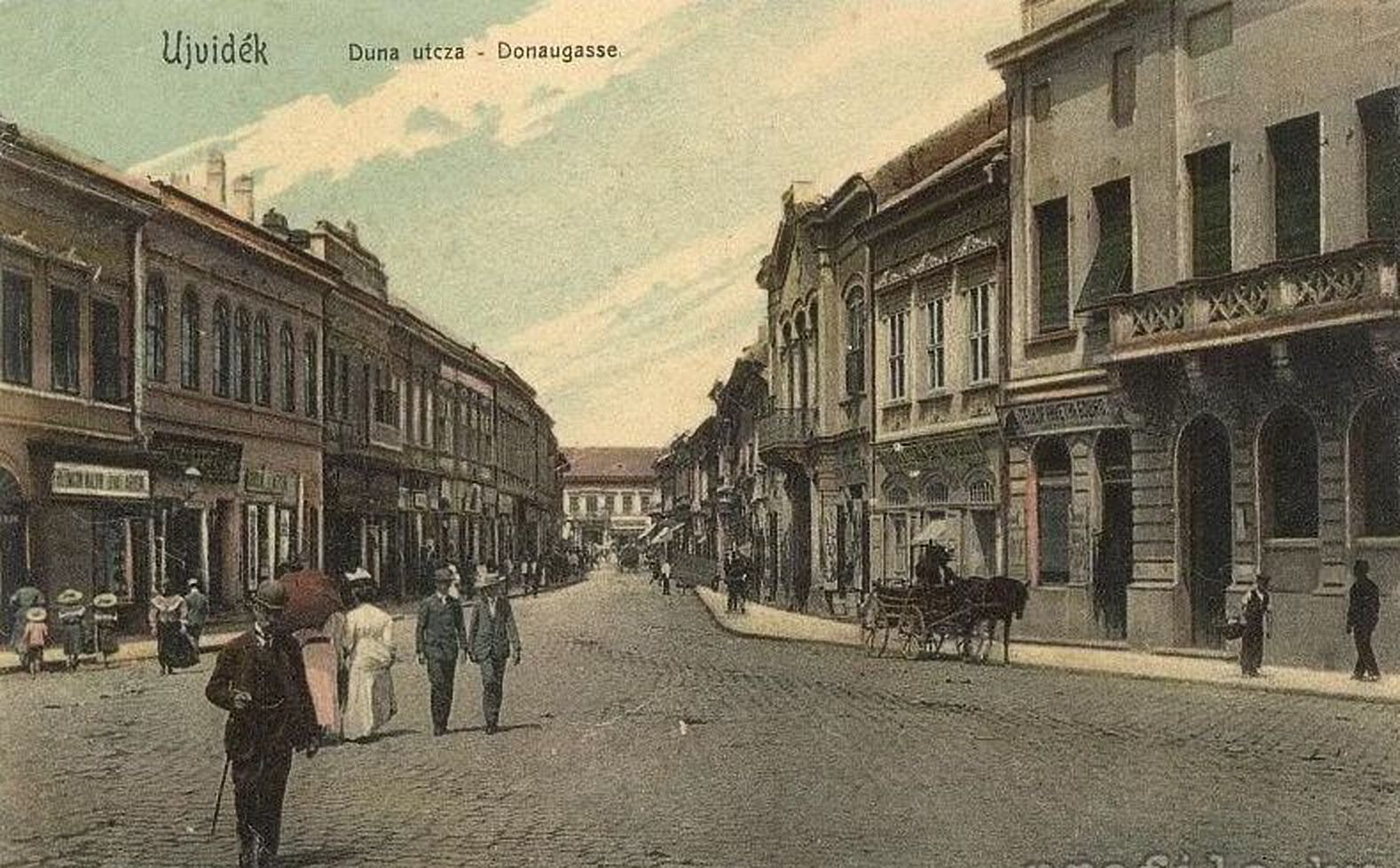Walkers coming up the street, Dunavska Street, Novi Sad, 1900s