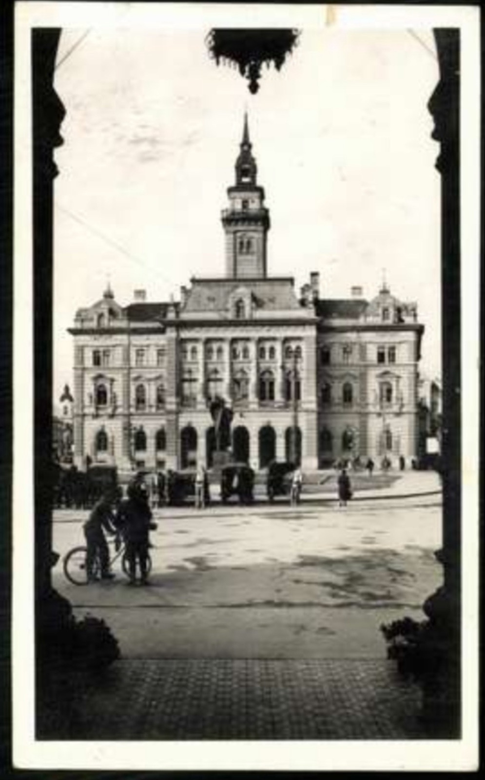Vignette View of the Town Hall With Cyclists in Silhouette, Novi Sad, by June 1941
