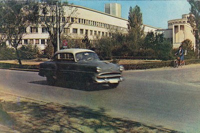 A saloon car passing a modernist block, Banovina Palace, Novi Sad, 1965